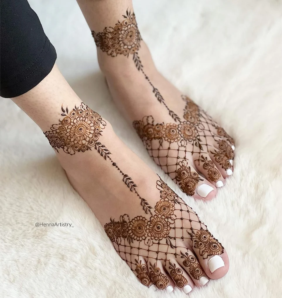 Professional Foot Mehndi Artist applying intricate bridal foot henna design